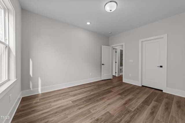 empty room featuring dark hardwood / wood-style flooring