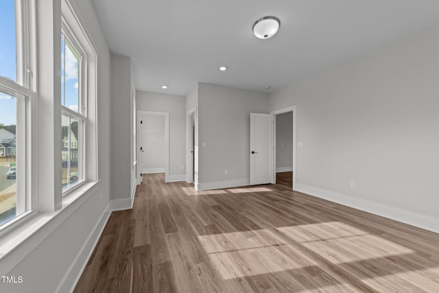 empty room featuring a wealth of natural light and light hardwood / wood-style floors