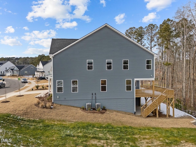 view of home's exterior featuring a wooden deck and central AC unit