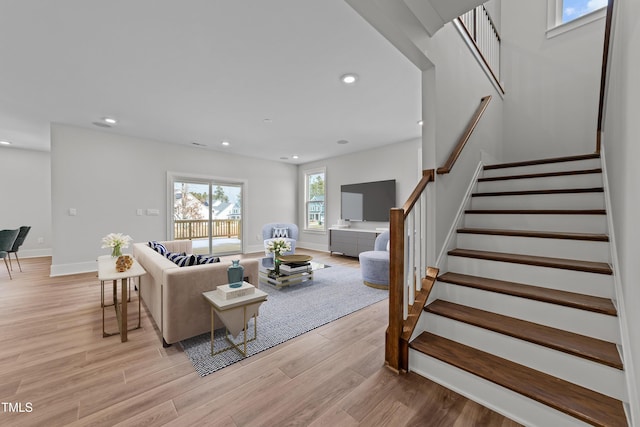 645 Silvercomet Dr, Knightdale, NC 27545 - living area featuring stairway, light wood finished floors, and recessed lighting