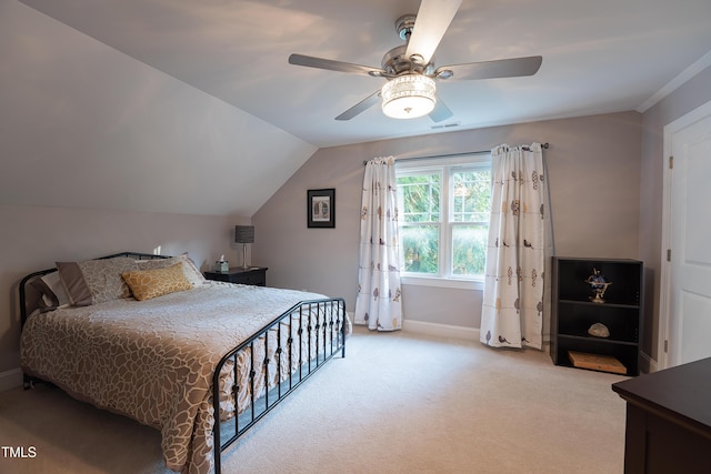 bedroom featuring ceiling fan, light colored carpet, and vaulted ceiling