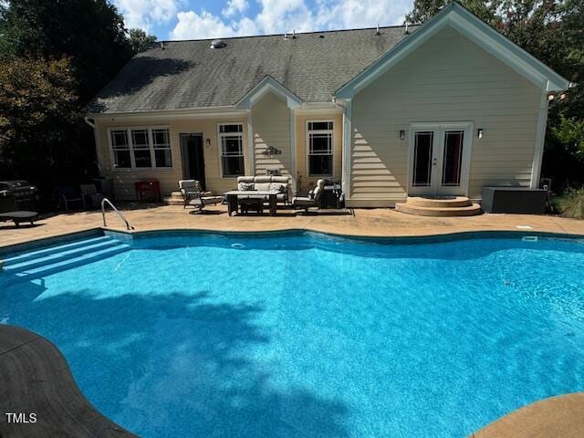 view of pool with central AC unit, an outdoor hangout area, and a patio