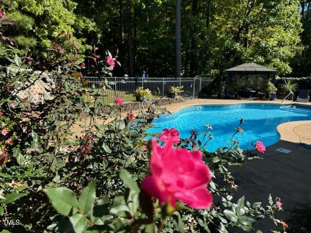 view of swimming pool featuring a gazebo