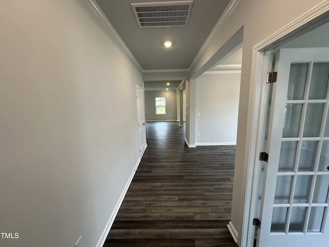 corridor with crown molding and dark hardwood / wood-style flooring