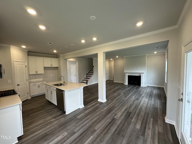 kitchen with dishwasher, an island with sink, sink, white cabinets, and dark hardwood / wood-style flooring