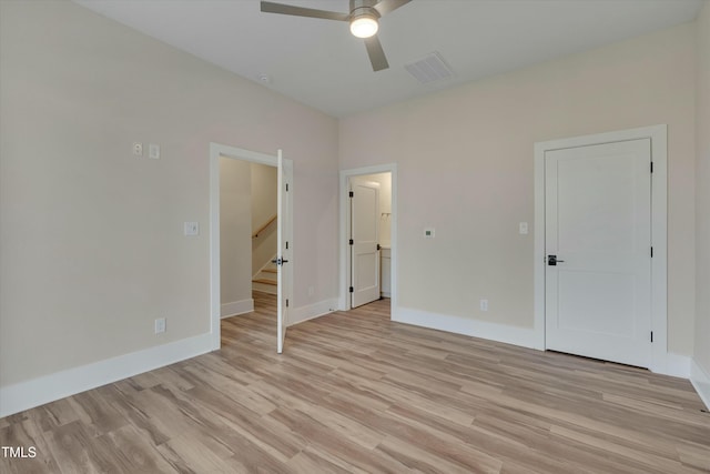 unfurnished bedroom with ceiling fan and light hardwood / wood-style floors