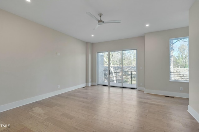 unfurnished room with ceiling fan and light hardwood / wood-style flooring