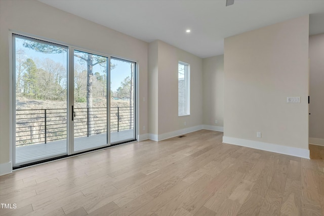 unfurnished room with a wealth of natural light and light wood-type flooring