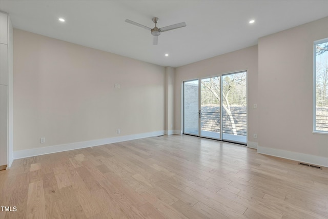 unfurnished room featuring ceiling fan and light hardwood / wood-style flooring