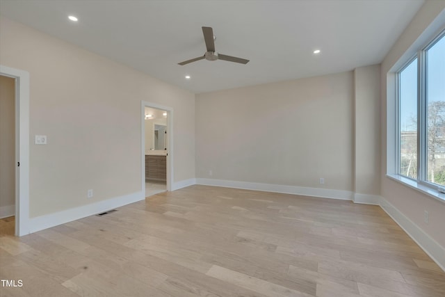 unfurnished room featuring ceiling fan and light hardwood / wood-style floors