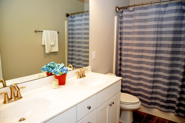 bathroom with vanity, a shower with curtain, and toilet