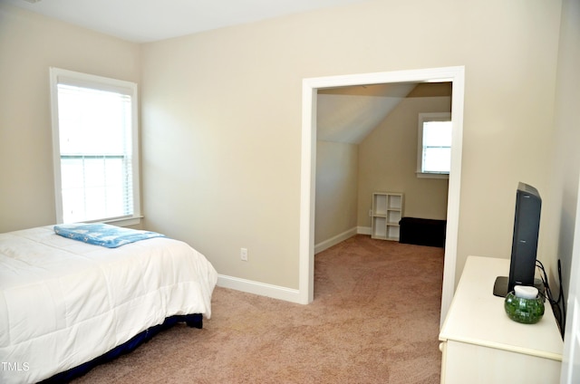 bedroom with light colored carpet