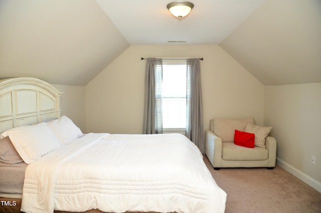 carpeted bedroom featuring vaulted ceiling