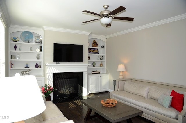 living room featuring crown molding, built in features, dark hardwood / wood-style floors, and ceiling fan