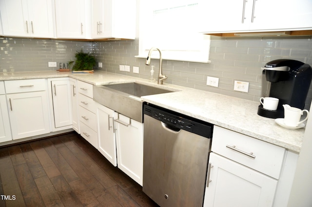 kitchen with sink, tasteful backsplash, dark hardwood / wood-style flooring, dishwasher, and white cabinets