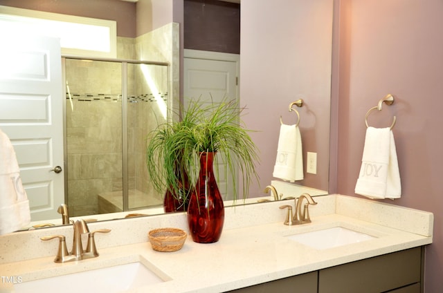 bathroom featuring vanity and an enclosed shower