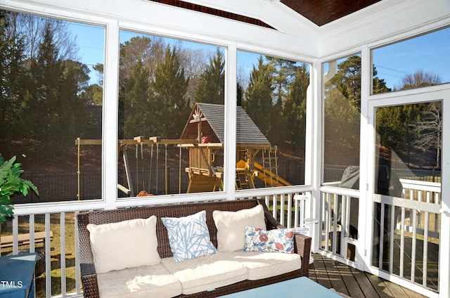 unfurnished sunroom with vaulted ceiling