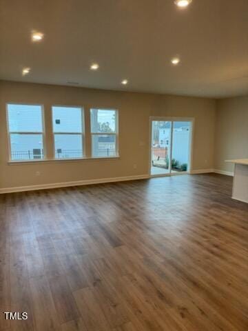 spare room featuring dark hardwood / wood-style floors