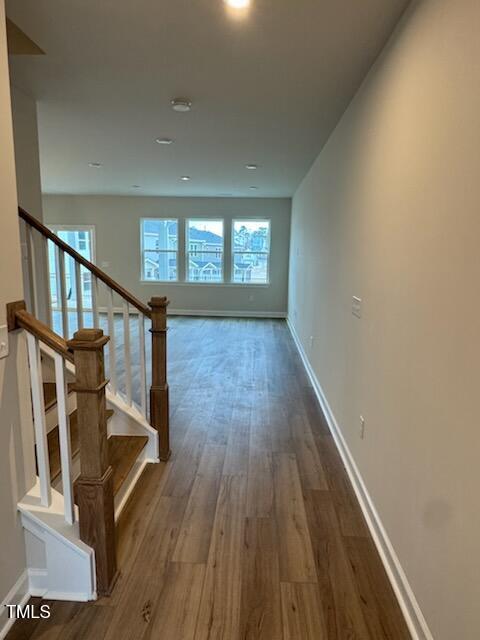 hall with dark hardwood / wood-style floors