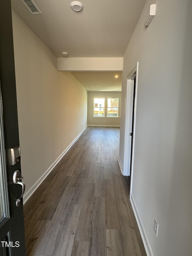 hall with wood-type flooring