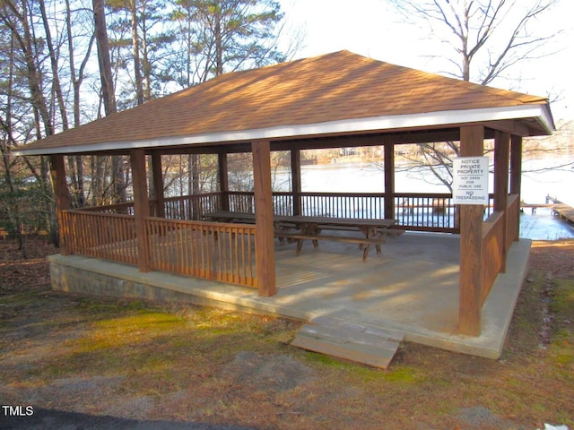 view of community with a water view