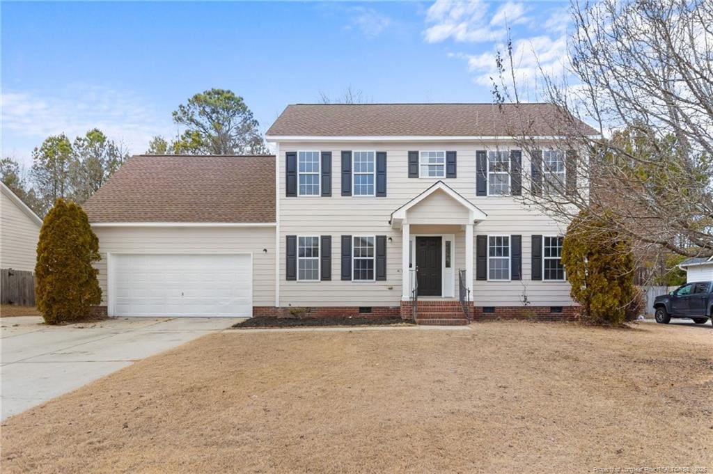 colonial home with a garage