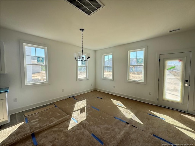 112 Peeler Cir, Raeford, NC 28376 - unfurnished dining area featuring visible vents, baseboards, and an inviting chandelier