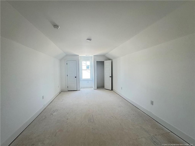 112 Peeler Cir, Raeford, NC 28376 - spare room featuring baseboards and lofted ceiling