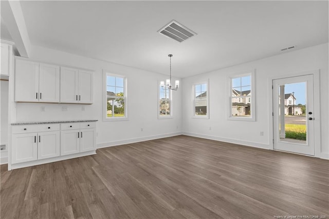 112 Peeler Cir, Raeford, NC 28376 - unfurnished dining area featuring a chandelier and dark wood-type flooring