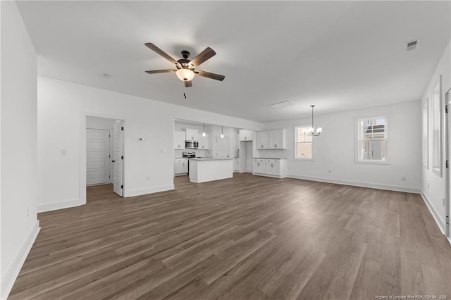 112 Peeler Cir, Raeford, NC 28376 - unfurnished living room with ceiling fan, a chandelier, and dark wood-style flooring