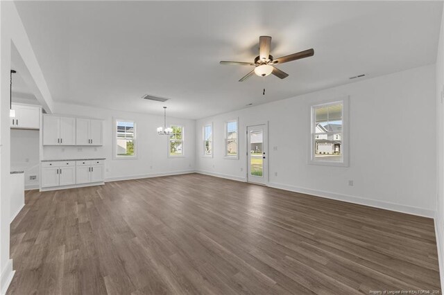 112 Peeler Cir, Raeford, NC 28376 - unfurnished living room with a chandelier, wood finished floors, and ceiling fan