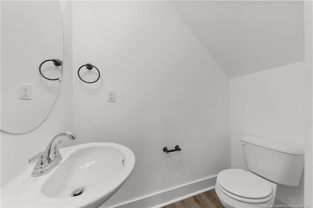 112 Peeler Cir, Raeford, NC 28376 - half bathroom featuring vaulted ceiling and wood finished floors