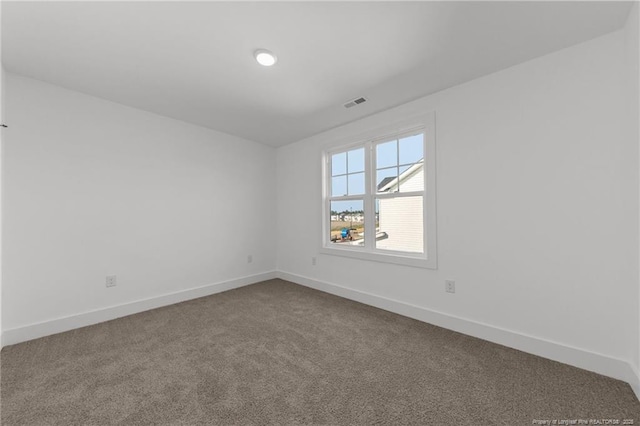 112 Peeler Cir, Raeford, NC 28376 - empty room with dark colored carpet and baseboards
