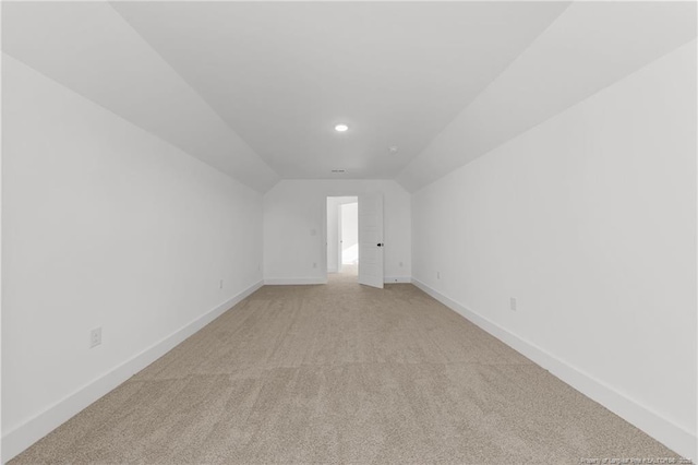 112 Peeler Cir, Raeford, NC 28376 - spare room featuring light colored carpet, lofted ceiling, and recessed lighting