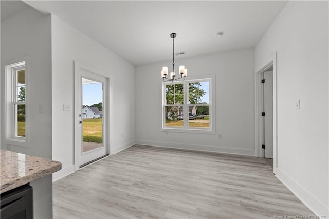 142 Peeler Cir, Raeford, NC 28376 - unfurnished dining area with healthy amount of natural light, a chandelier, light wood-style floors, and wine cooler
