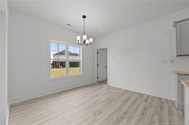 142 Peeler Cir, Raeford, NC 28376 - unfurnished dining area featuring light wood-style flooring and a chandelier