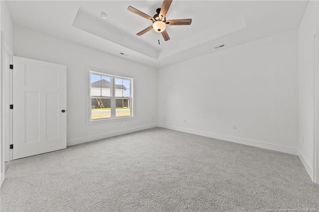 142 Peeler Cir, Raeford, NC 28376 - carpeted spare room featuring ceiling fan and a tray ceiling