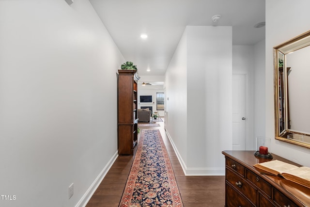 hallway with dark hardwood / wood-style floors