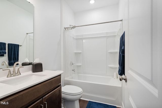 full bathroom featuring washtub / shower combination, vanity, toilet, and wood-type flooring