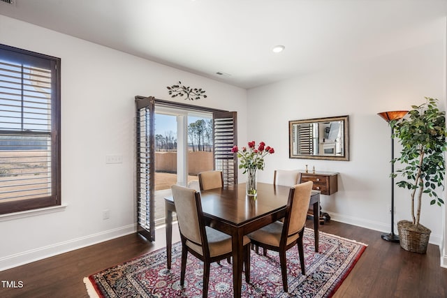 dining area featuring dark hardwood / wood-style flooring