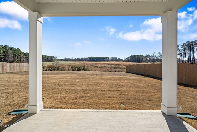 view of yard with a rural view