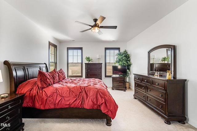 bedroom featuring light carpet and ceiling fan