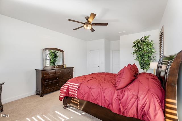 bedroom featuring ceiling fan and light carpet