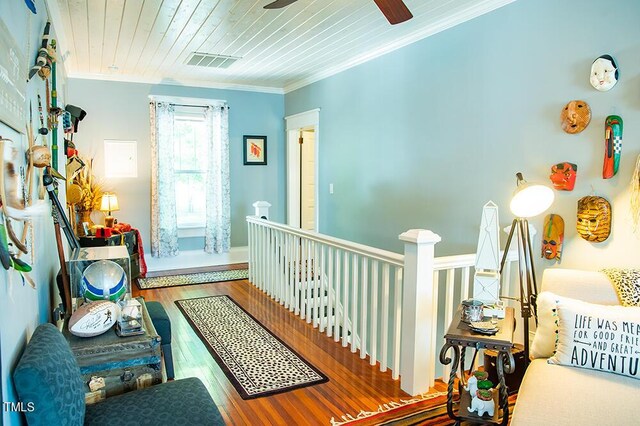 283 NC Highway 62 S, Yanceyville, NC 27379 - hall featuring an upstairs landing, ornamental molding, wood finished floors, wood ceiling, and baseboards