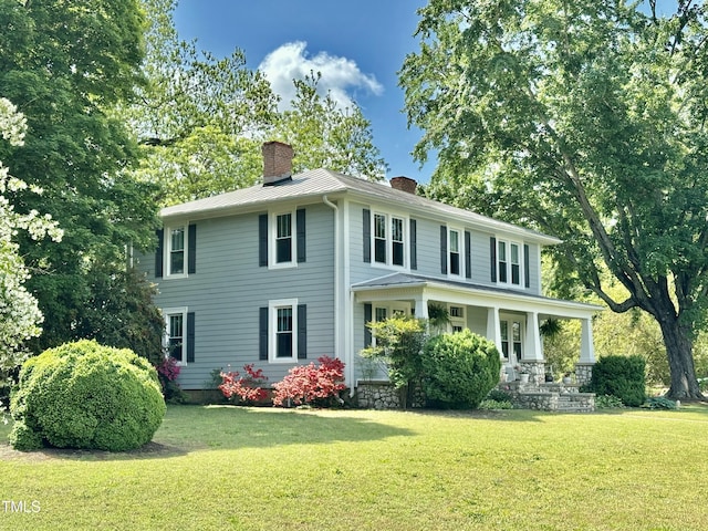 283 NC Highway 62 S, Yanceyville, NC 27379 - back of house featuring a chimney, a porch, and a yard