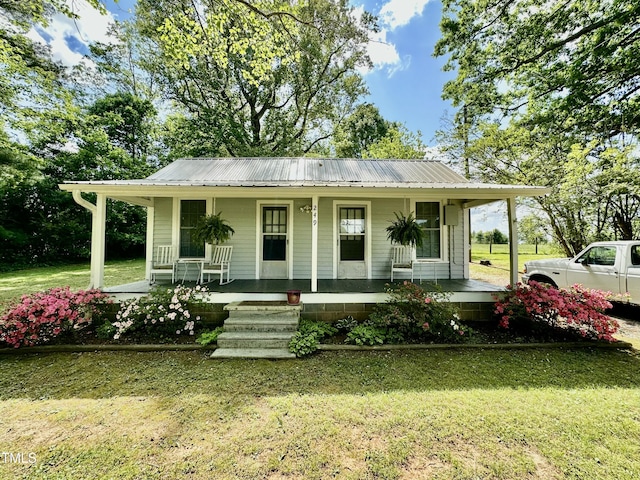 283 NC Highway 62 S, Yanceyville, NC 27379 - view of front of house with covered porch, a front lawn, and metal roof