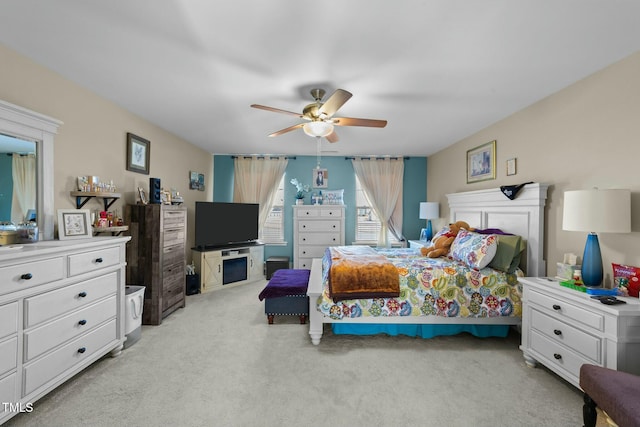 carpeted bedroom featuring ceiling fan