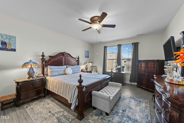 bedroom featuring hardwood / wood-style flooring and ceiling fan