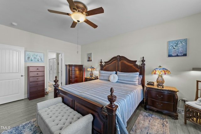 bedroom featuring ensuite bathroom, hardwood / wood-style floors, and ceiling fan