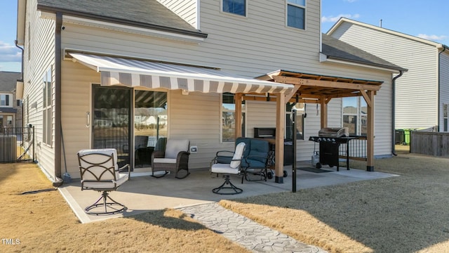 rear view of property with a patio area and a lawn